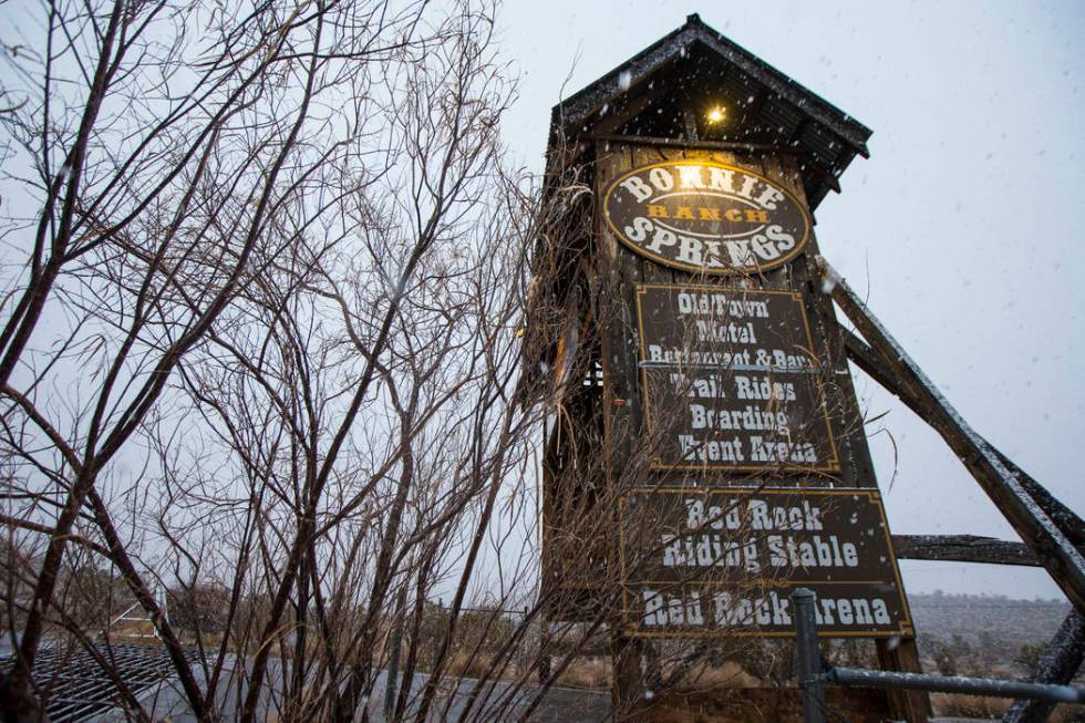 Snow falls around the entrance to Bonnie Springs outside of Las Vegas on Wednesday, Feb. 20, 20 ...