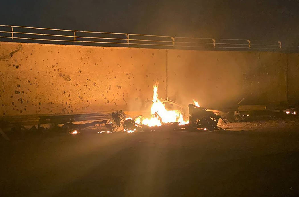 This photo released by the Iraqi Prime Minister Press Office shows a burning vehicle at the Bag ...