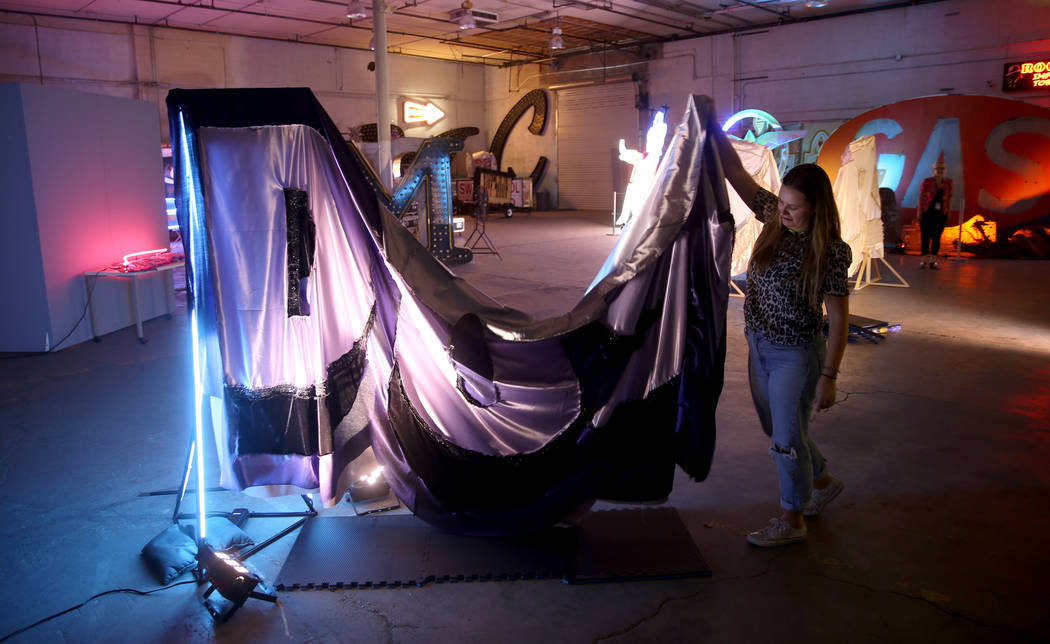 Julie Henson, artist in residence for the Neon Museum, works on one of her sculptures at the mu ...