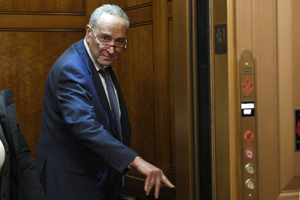 Senate Minority Leader Sen. Chuck Schumer of N.Y., arrives on Capitol Hill in Washington, Frida ...