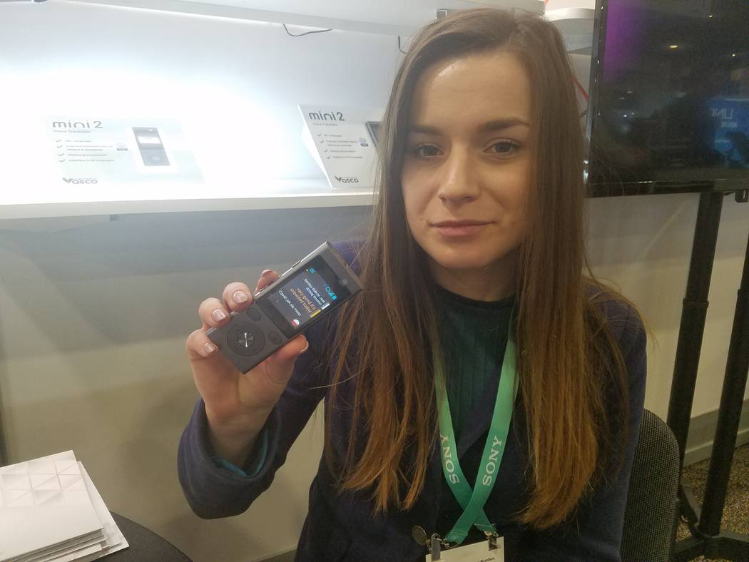 Karolina Szulc, marketing manager of Vasco Electronics, demonstrates the Vasco Mini 2 translato ...