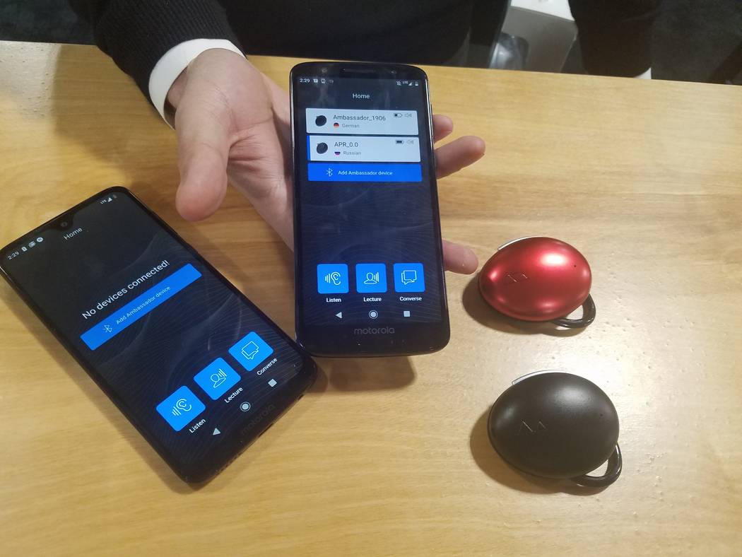 The components for the Ambassador Interpreter include black or wine-red, clamshell design over- ...