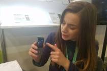 Karolina Szulc, marketing manager of Vasco Electronics, demonstrates the Vasco Mini 2 translato ...