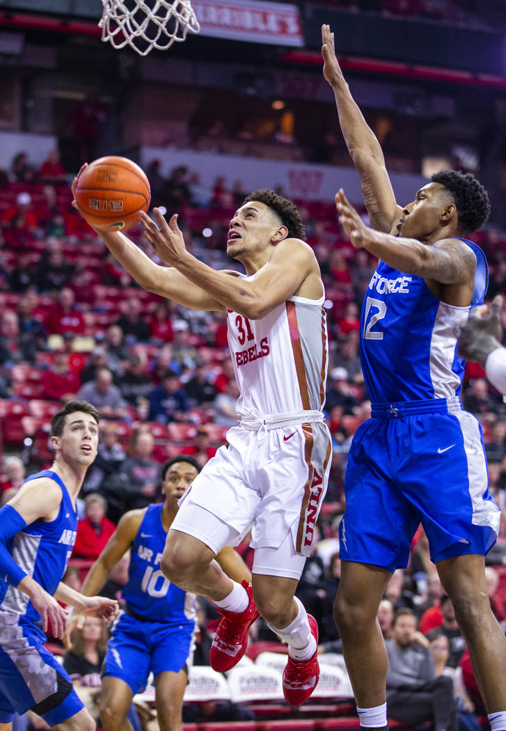 UNLV Rebels guard Marvin Coleman (31) gets inside of Air Force Falcons forward Lavelle Scottie ...