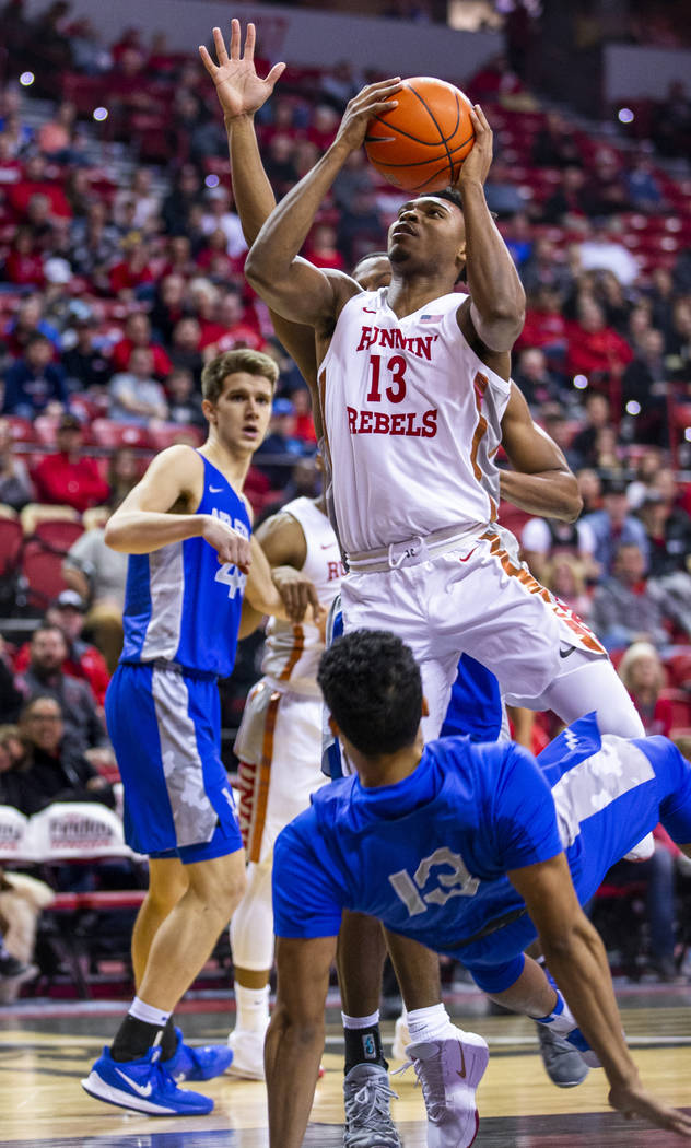 UNLV Rebels guard Bryce Hamilton (13) eyes a shot after taking a charge by Air Force Falcons gu ...