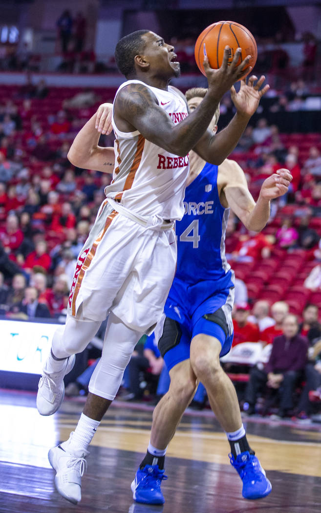 UNLV Rebels guard Amauri Hardy (3) gets inside of Air Force Falcons guard Marcus Hill (14) for ...