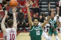 UNLV Rebels guard Jonah Antonio (10) shoots a corner three over Eastern Michigan Eagles guard D ...