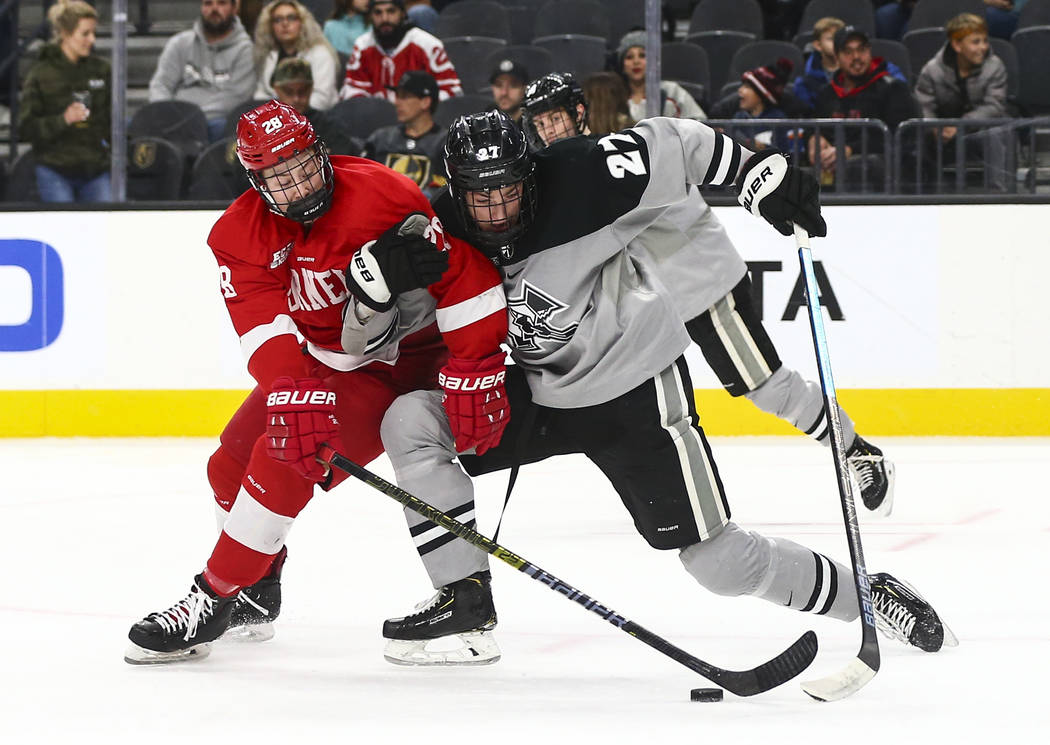 Cornell Big Red's Brenden Locke (28) and Providence Friars' Tyce Thompson (27) battle for the p ...