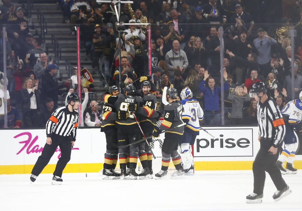 The Golden Knights celebrate a goal by Ryan Reaves during the second period of an NHL hockey ga ...