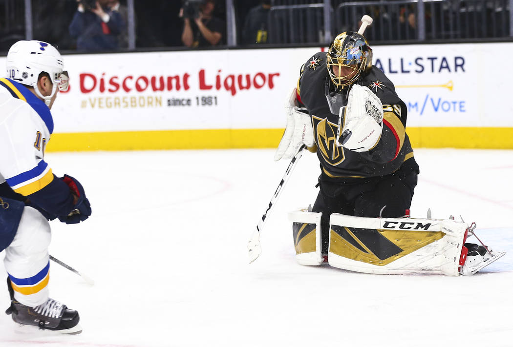 Golden Knights goaltender Marc-Andre Fleury (29) stops the puck in front of St. Louis Blues' Br ...
