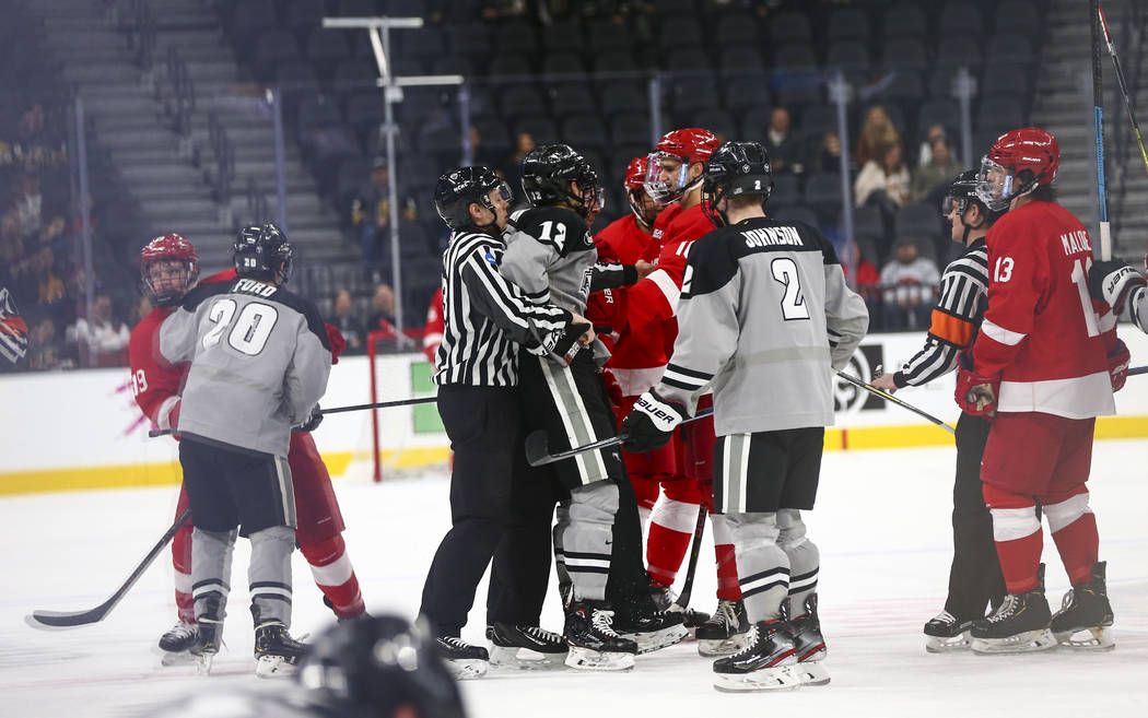 Providence Friars' Jack Dugan (12) gets involved in a scuffle with Cornell during the second pe ...