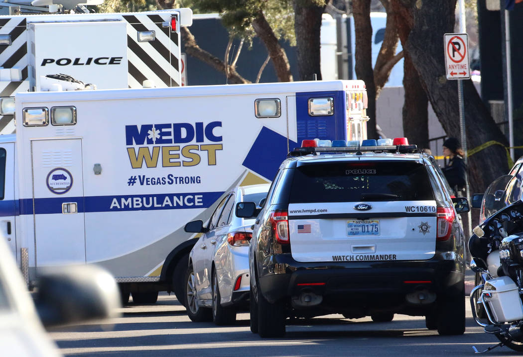 An ambulance leaves the scene as Las Vegas police are investigating officers involved in a shoo ...