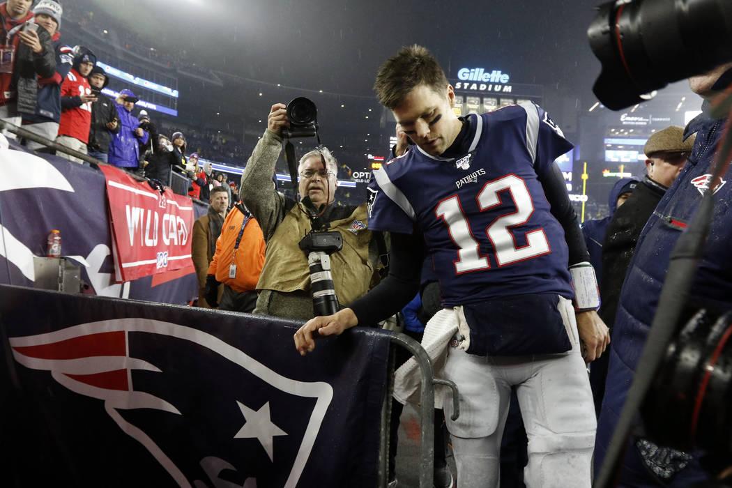 New England Patriots quarterback Tom Brady leaves the field after losing an NFL wild-card playo ...