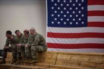U.S Army Soldiers with the 82nd Airborne Division wait to be deployed to the Middle East on Sat ...