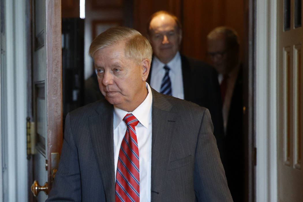 Sen. Lindsey Graham, R-S.C., walks to the Senate floor, Thursday, Dec. 19, 2019, on Capitol Hil ...