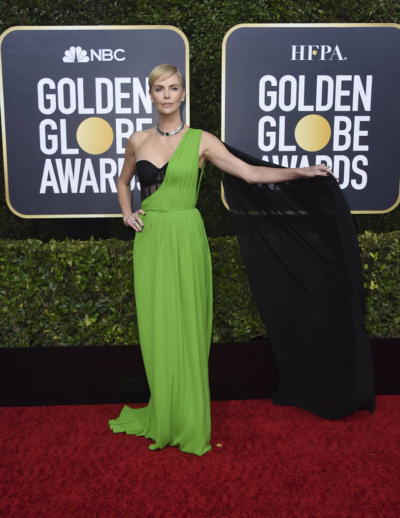 Charlize Theron arrives at the 77th annual Golden Globe Awards at the Beverly Hilton Hotel on S ...