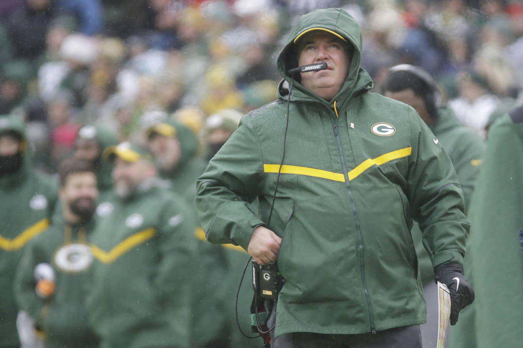 Green Bay Packers' Head Coach Mike McCarthy watches a replay during the first half of a game ag ...