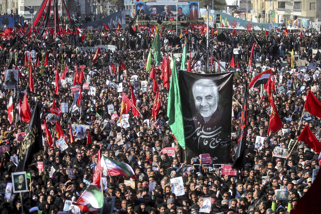 Mourners attend a funeral ceremony for Iranian Gen. Qassem Soleimani and his comrades, who were ...