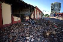 Debris from a collapsed wall of a building litters the ground after an earthquake struck Puerto ...