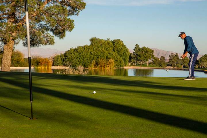 Golfer Tama Mamaia sends a putt towards the pin at hole #2 on the Mountain Course at Angel Park ...