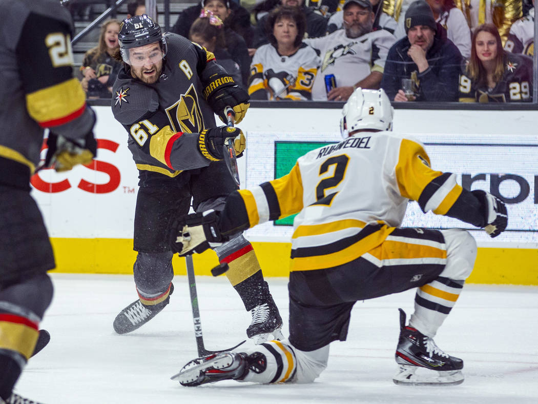 Vegas Golden Knights' Mark Stone (61) sends a shot past Pittsburgh Penguins' Chad Ruhwedel (2) ...