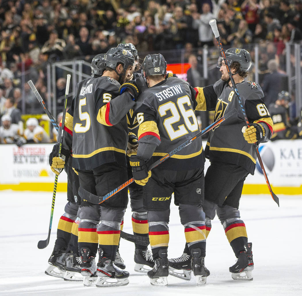 The Vegas Golden Knights celebrate a goal against the Pittsburgh Penguins during the second per ...
