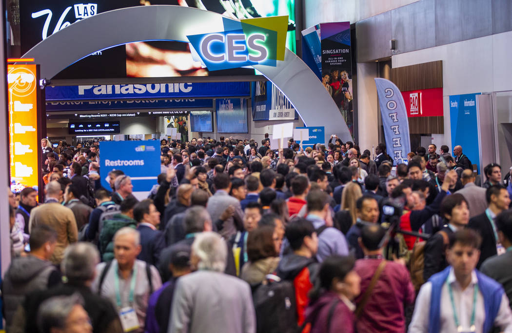 Attendees gather outside of the main entrance for Central Hall as CES Day 1 is about to open at ...