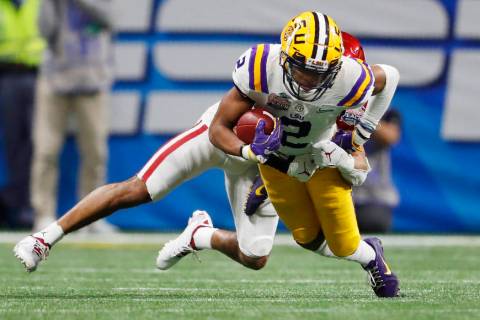 LSU wide receiver Justin Jefferson (2) runs against Oklahoma cornerback Woodi Washington (5) du ...