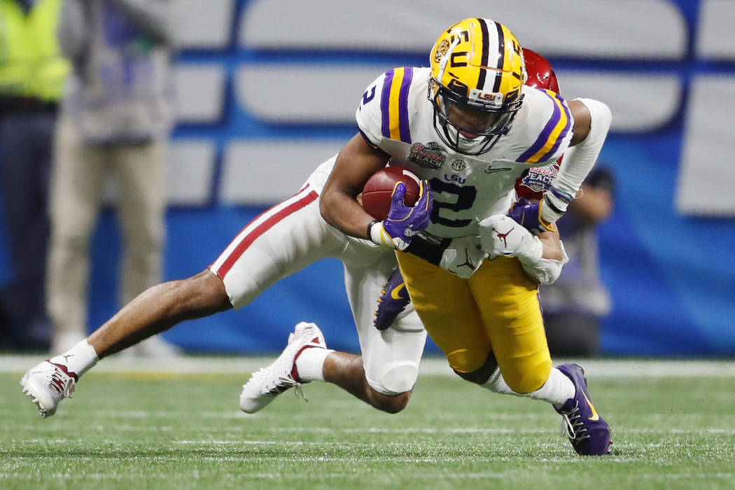 LSU wide receiver Justin Jefferson (2) runs against Oklahoma cornerback Woodi Washington (5) du ...