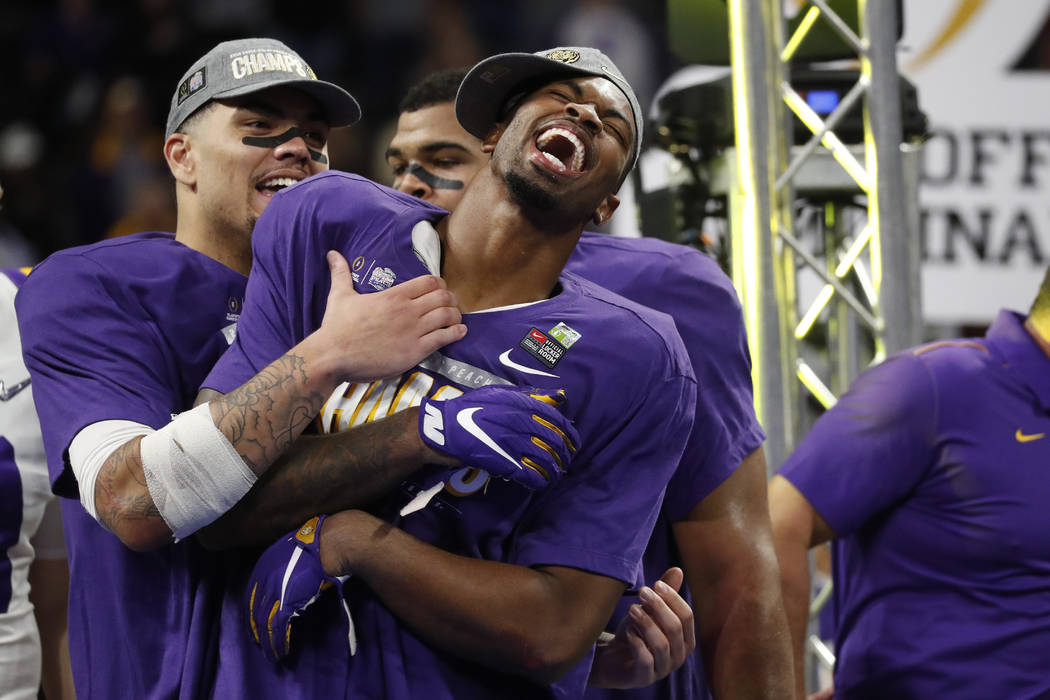 LSU players celebrate winning the Peach Bowl NCAA semifinal college football playoff game again ...