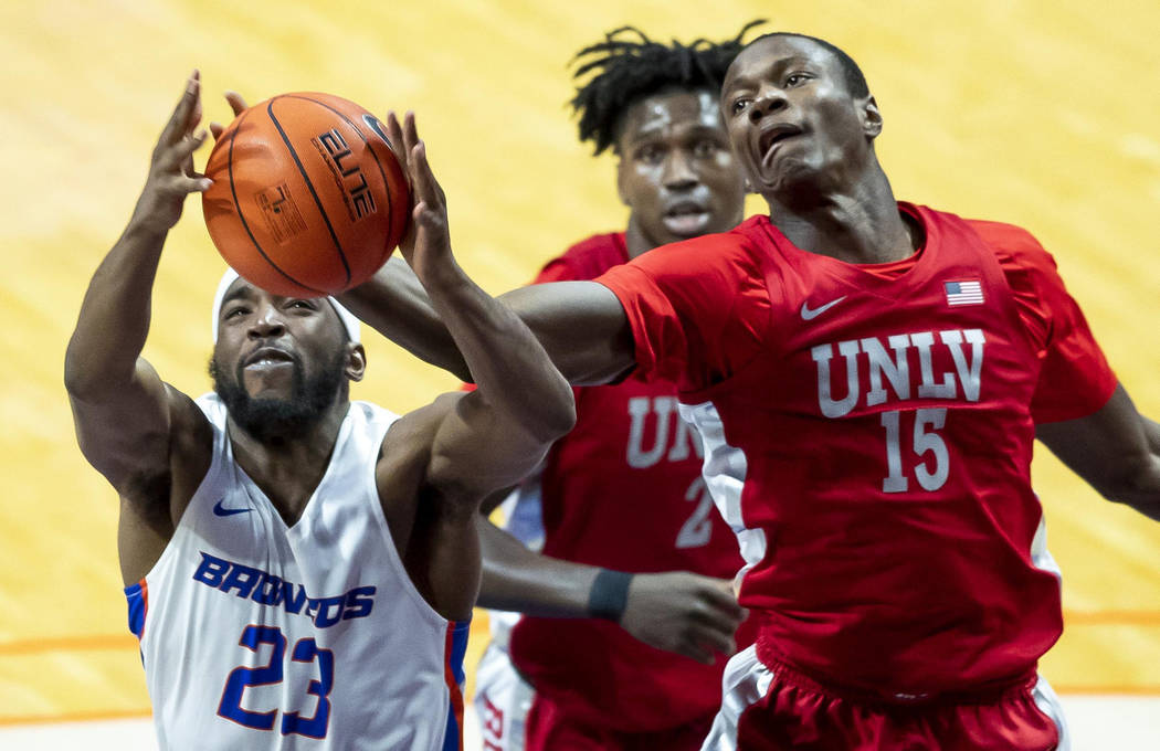 Boise State guard RJ Williams fights for a rebound with UNLV forward Cheickna Dembele during th ...