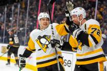 Pittsburgh Penguins' Dominik Simon, left, celebrates a goal by teammate Patric Hornqvist (72) d ...