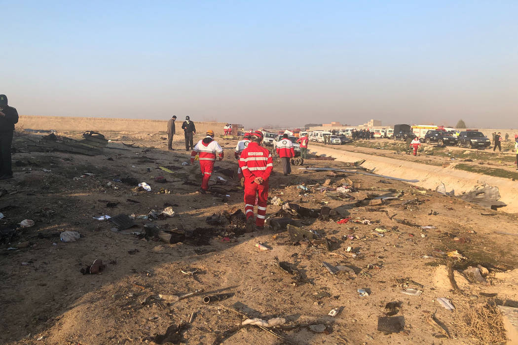 Debris is seen from a plane crash on the outskirts of Tehran, Iran, Wednesday, Jan. 8, 2019. A ...