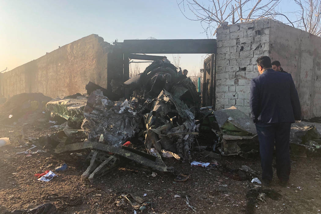 Debris is seen from a plane crash on the outskirts of Tehran, Iran, Wednesday, Jan. 8, 2019. A ...
