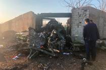 Debris is seen from a plane crash on the outskirts of Tehran, Iran, Wednesday, Jan. 8, 2019. A ...