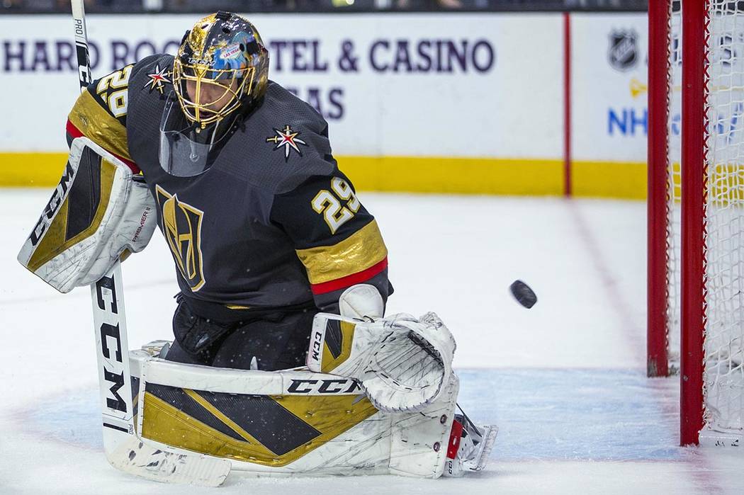 The puck goes past Vegas Golden Knights goaltender Marc-Andre Fleury on a shot by the Pittsburg ...