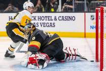Pittsburgh Penguins' Brandon Tanev (13) scores on Vegas Golden Knights goaltender Marc-Andre Fl ...