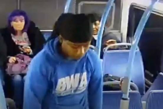 A screengrab from video shows a man, center, who punched an older man in the face on a Regional ...