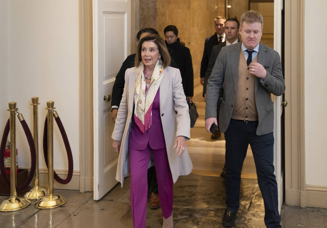 Speaker of the House Nancy Pelosi, D-Calif., arrives at the Capitol in Washington, Tuesday Jan. ...