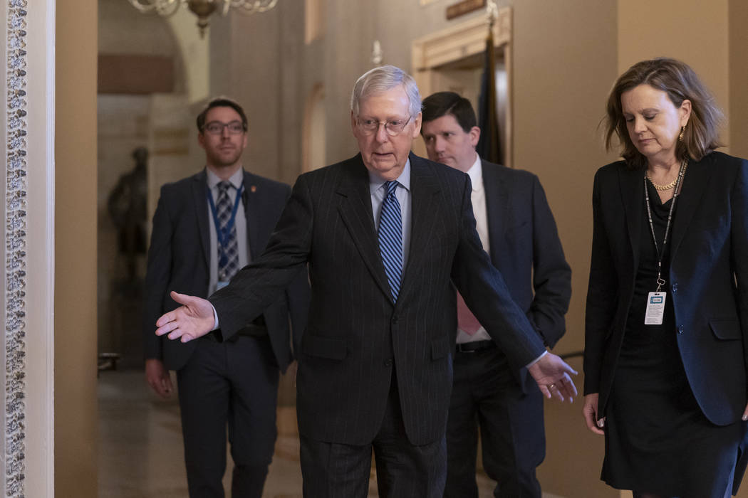 Senate Majority Leader Mitch McConnell, R-Ky., arrives for a closed meeting with fellow Republi ...