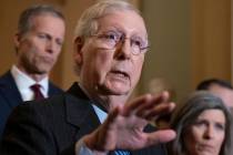 Senate Majority Leader Mitch McConnell, R-Ky., joined by Majority Whip John Thune, R-S.D., left ...