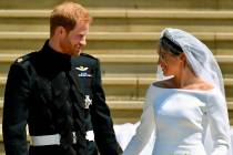 FILE - In this Saturday, May 19, 2018 file photo, Britain's Prince Harry and Meghan Markle walk ...