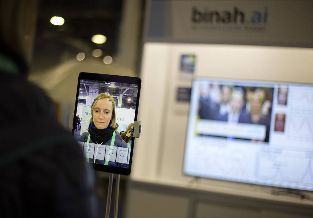 Claire Thelliez of Paris, France tries out the Binah.ai app on Wednesday, Jan. 8, 2020, at CES ...