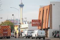 Las Vegas firefighters respond to the scene of a fire at the Alpine Apartment Motel that left 6 ...