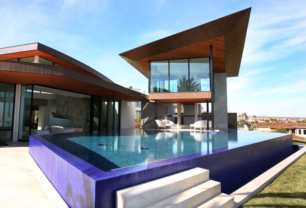 A swimming pool with Zen room, right top, and a modern master bedroom, left, are seen at the ma ...