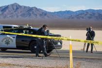 Police work the scene of a fatal officer involved shooting south of Primm on I-15 North, Wednes ...
