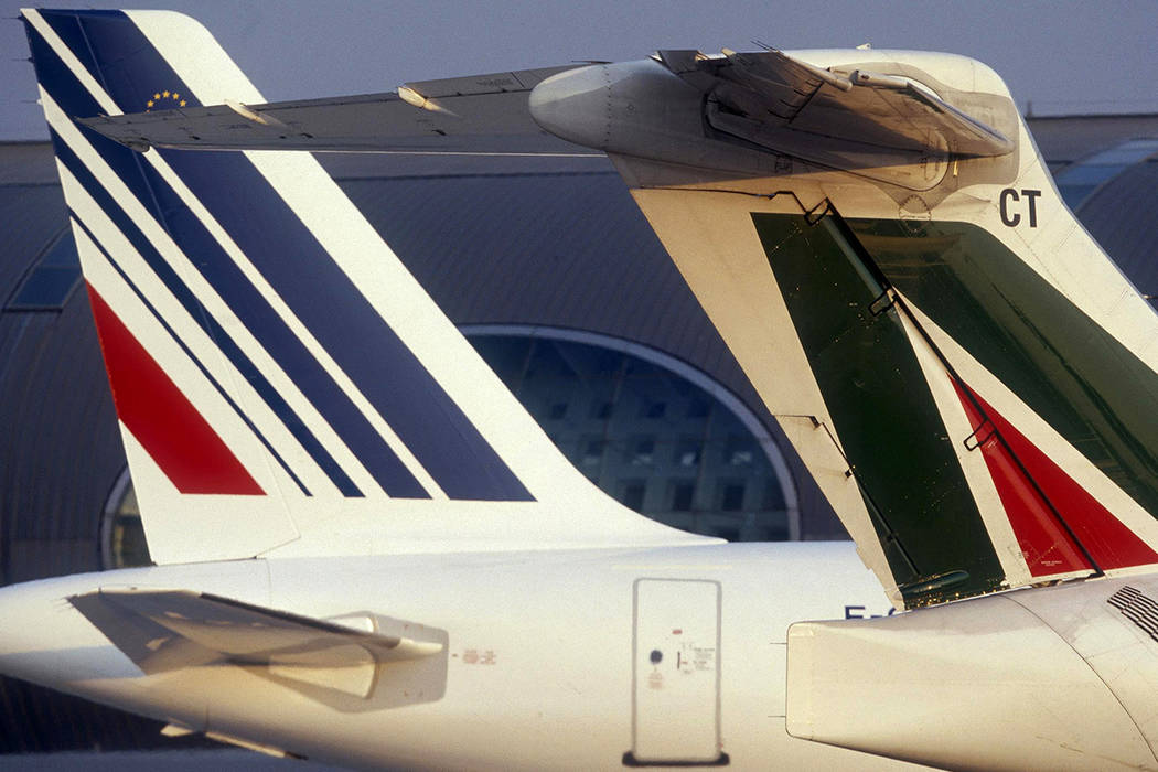 In this undated photo released by Air France, an Air France plane, left, and an Alitalia plane, ...