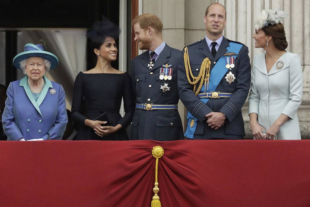 In a Tuesday, July 10, 2018, file photo Britain's Queen Elizabeth II, and from left, Meghan the ...