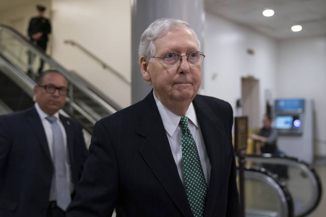 Senate Majority Leader Mitch McConnell, R-Ky., heads to a briefing with Secretary of State Mike ...