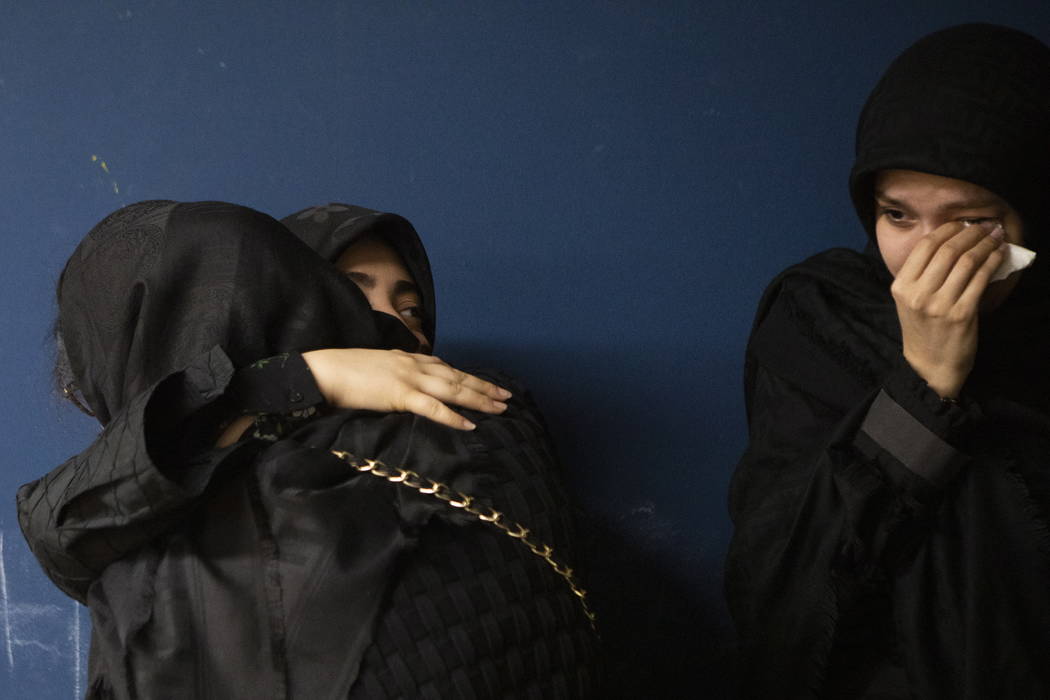 Members of Toronto's Iranian community attend a vigil in Toronto on Wednesday, Jan. 8, 2020, to ...